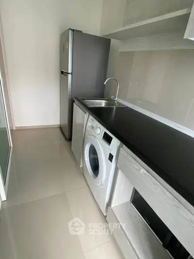 Modern kitchen with sleek appliances and minimalist design