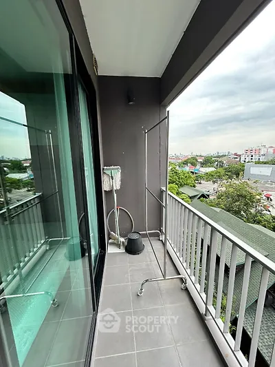 Charming balcony with city view, perfect for relaxation and enjoying the skyline.