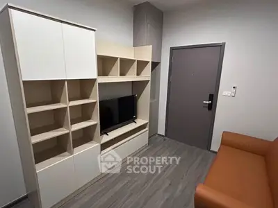 Modern living room with sleek storage unit and cozy sofa