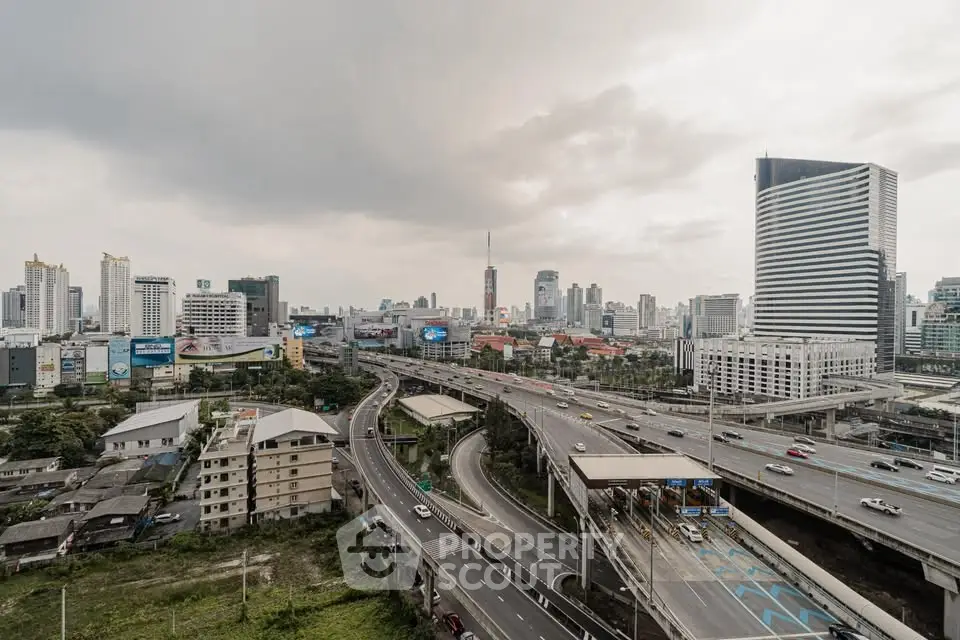 Stunning cityscape view with highways and modern skyscrapers, perfect for urban living enthusiasts.
