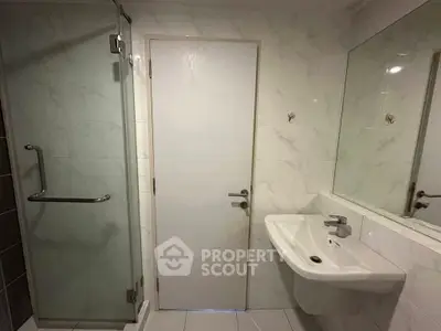 Modern bathroom with glass shower and sleek sink design