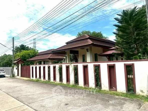 Charming suburban house with lush greenery and classic architecture