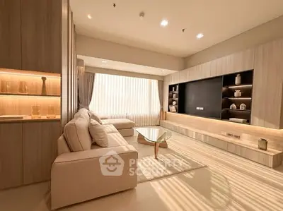 Luxurious modern living room with elegant decor and ample natural light.