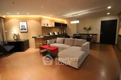 Spacious modern living room with elegant decor and cozy seating area.
