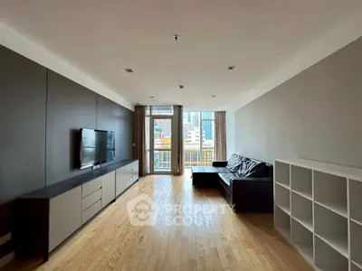 Spacious modern living room with city view and sleek furniture