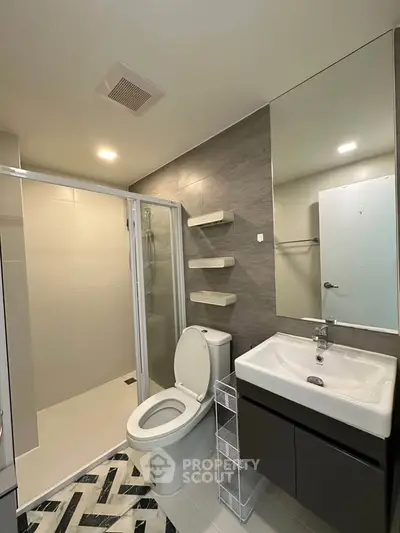 Modern bathroom with sleek design and spacious shower area