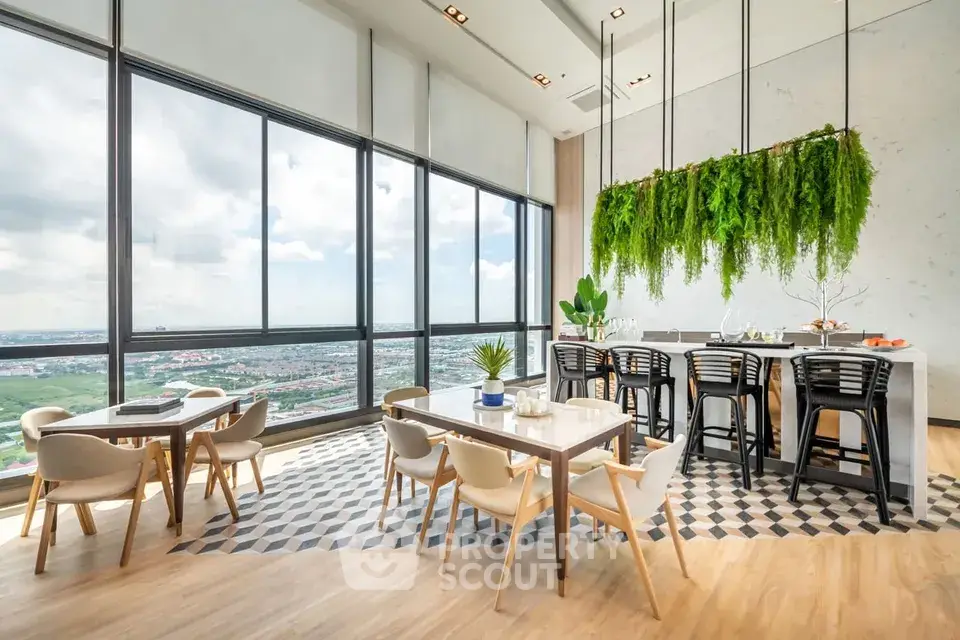 Stunning modern dining area with panoramic city views and lush greenery accents.
