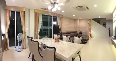 Spacious modern living room with elegant dining area and stylish furniture
