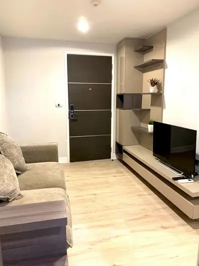 Modern living room with sleek furniture and stylish shelving unit