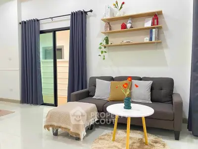 Cozy living room with modern decor and sliding glass door