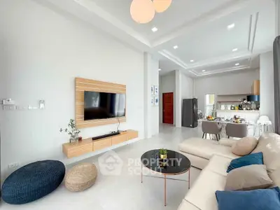 Spacious modern living room with open kitchen and stylish decor