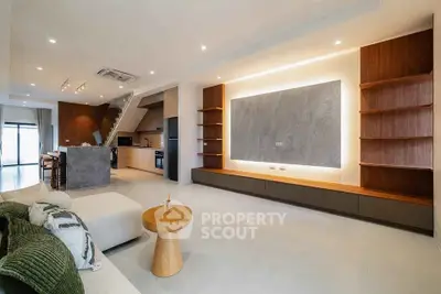 Spacious modern living room with open kitchen and stylish decor