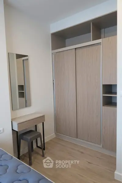 Modern bedroom with built-in wardrobe and stylish vanity set