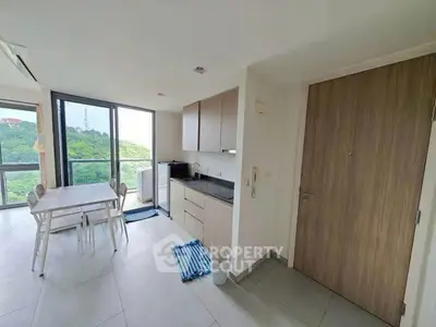Modern kitchen with dining area and scenic view from large windows