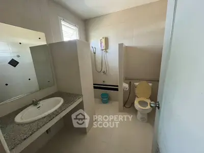 Spacious bathroom with modern fixtures and neutral tones