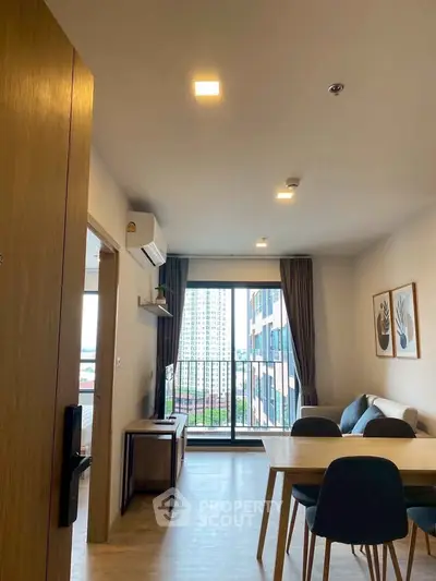 Modern living room with balcony view in high-rise apartment