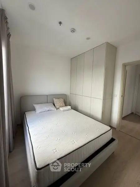 Cozy bedroom with modern design and ample natural light
