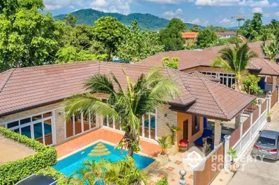 Stunning tropical villa with private pool and lush greenery, perfect for luxury living.