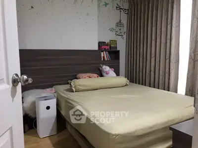 Cozy bedroom with modern decor and ample natural light, featuring a comfortable bed and stylish furnishings.