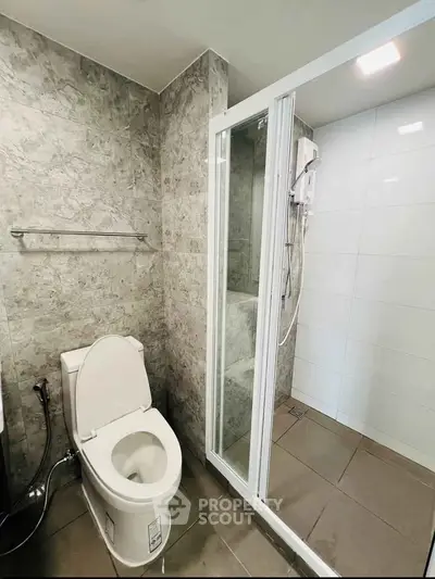 Modern bathroom with sleek shower and elegant tile design