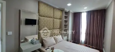 Luxurious bedroom with elegant decor and ample natural light