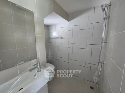 Modern bathroom with sleek tiles and contemporary fixtures