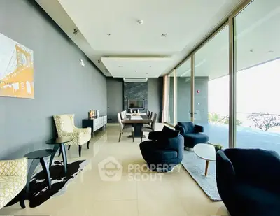 Luxurious modern living room with floor-to-ceiling windows and stylish furniture