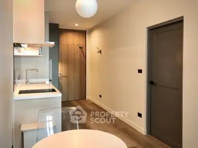 Modern kitchen with sleek design and open layout in a contemporary apartment.
