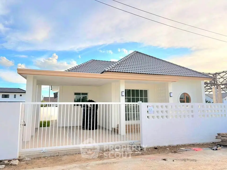 Charming single-story house with modern design and spacious front yard, perfect for family living.