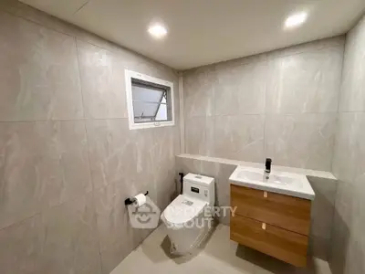 Modern bathroom with sleek fixtures and neutral tile design