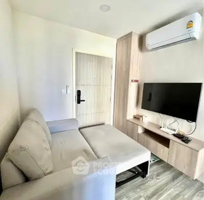 Modern living room with sleek furniture and air conditioning in a cozy apartment.