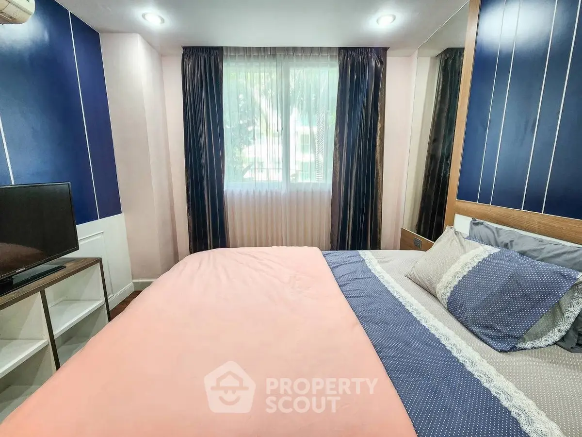 Cozy bedroom with stylish decor and natural light