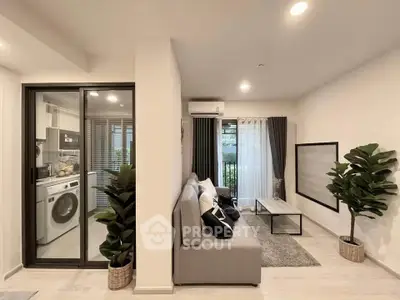 Modern living room with washing machine and stylish decor