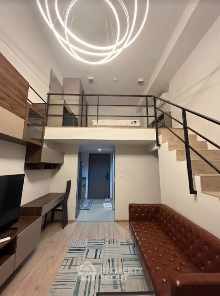 Modern loft-style living room with high ceiling and stylish lighting