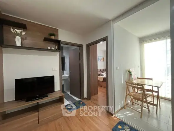 Modern apartment interior with wooden flooring and natural light