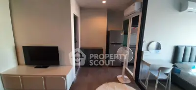 Modern apartment interior with sleek furniture and appliances, featuring a cozy living area and stylish decor.