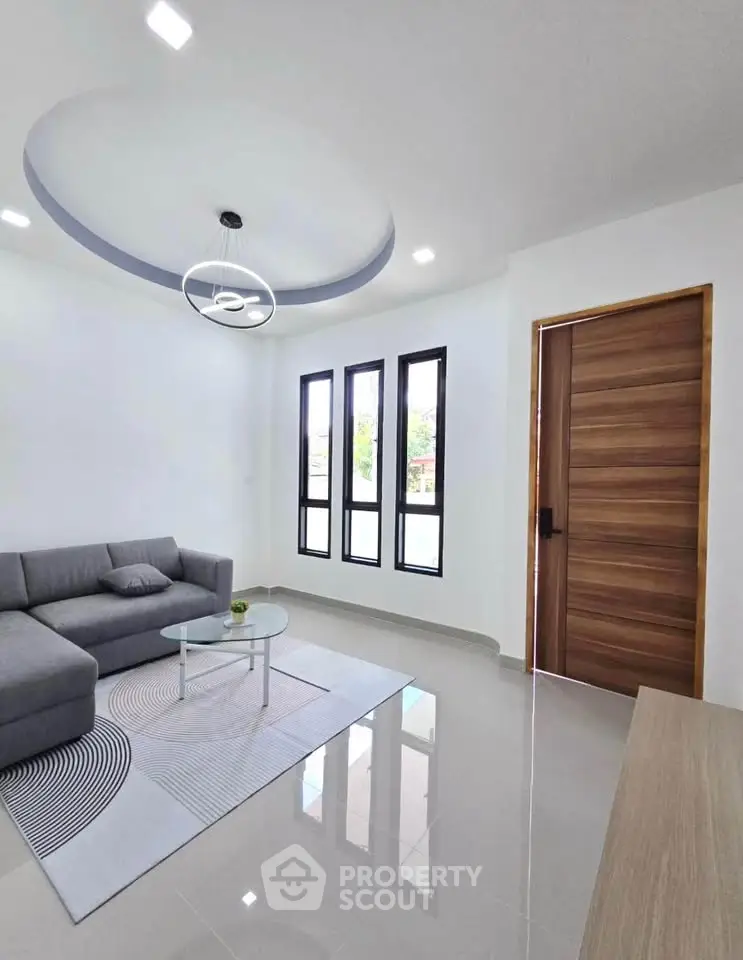 Modern living room with sleek design and stylish lighting
