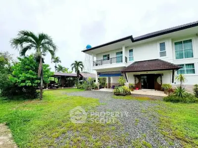 Stunning two-story home with lush garden and spacious driveway, perfect for family living.