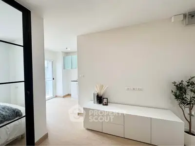 Modern minimalist apartment interior with sleek white furniture and natural light