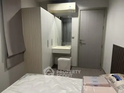 Modern bedroom with sleek wardrobe and vanity in a cozy apartment