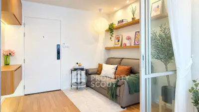 Charming modern living room with cozy sofa, stylish decor, and natural light, perfect for relaxation.