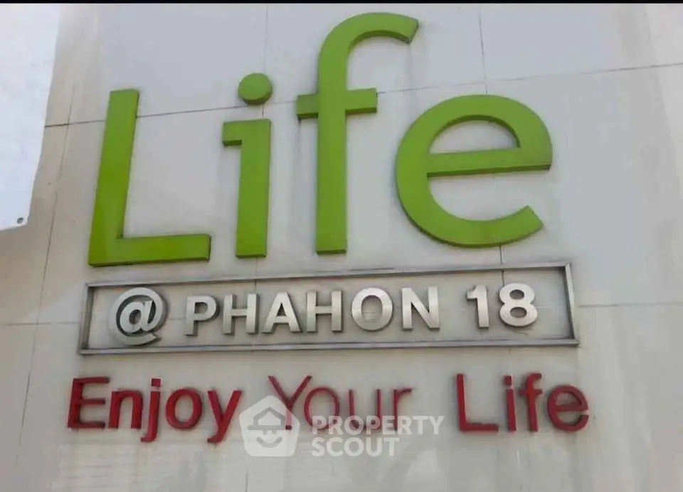 Life @ Phahon 18 building exterior signage promoting vibrant living.