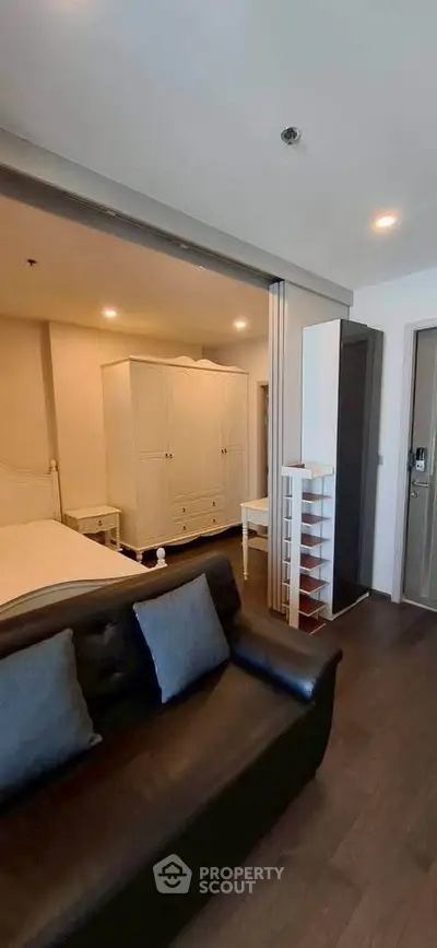 Modern studio apartment with cozy living area and stylish furniture