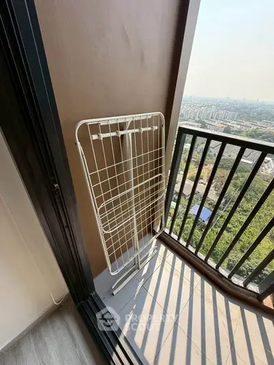 Cozy balcony with stunning city view, perfect for relaxation and enjoying the outdoors.