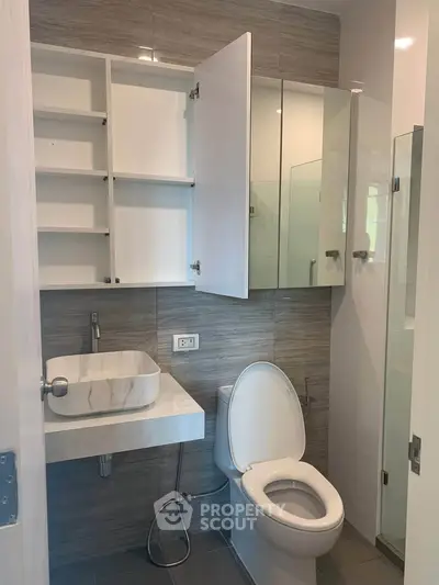 Modern bathroom with sleek fixtures and ample storage space