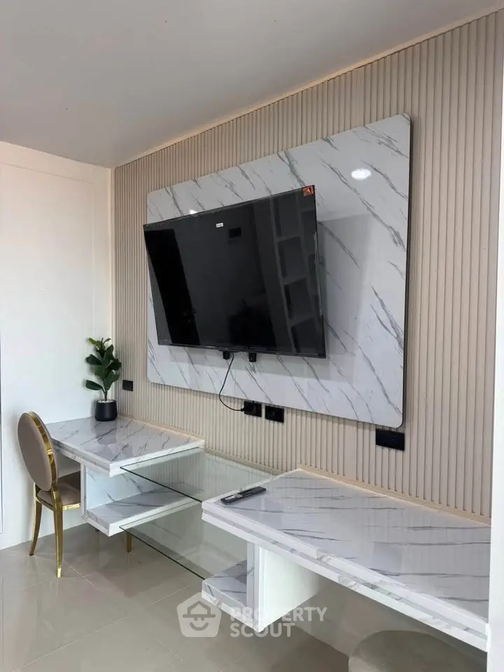 Modern living room with marble TV wall and elegant furniture
