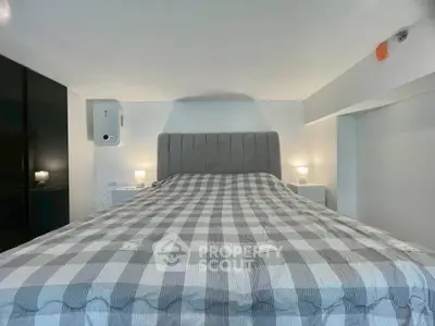 Cozy bedroom with modern decor and plush bedding, perfect for relaxation and comfort.