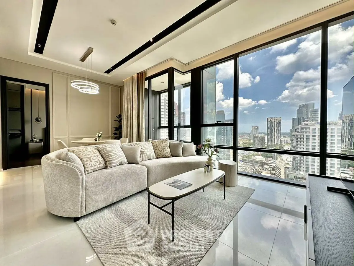 Luxurious living room with panoramic city views and modern decor
