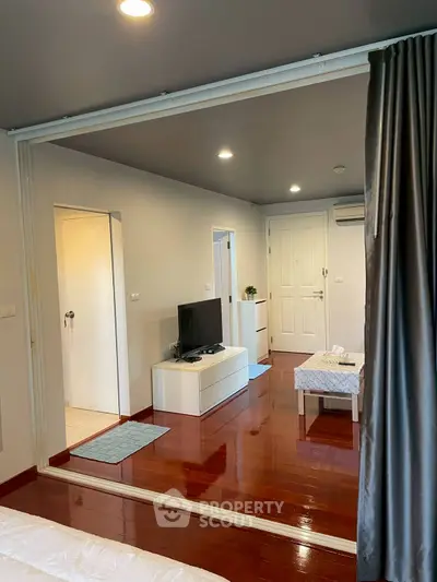 Modern living room with sleek design and wooden flooring