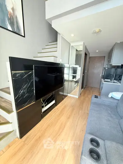 Modern duplex living room with sleek staircase and stylish decor